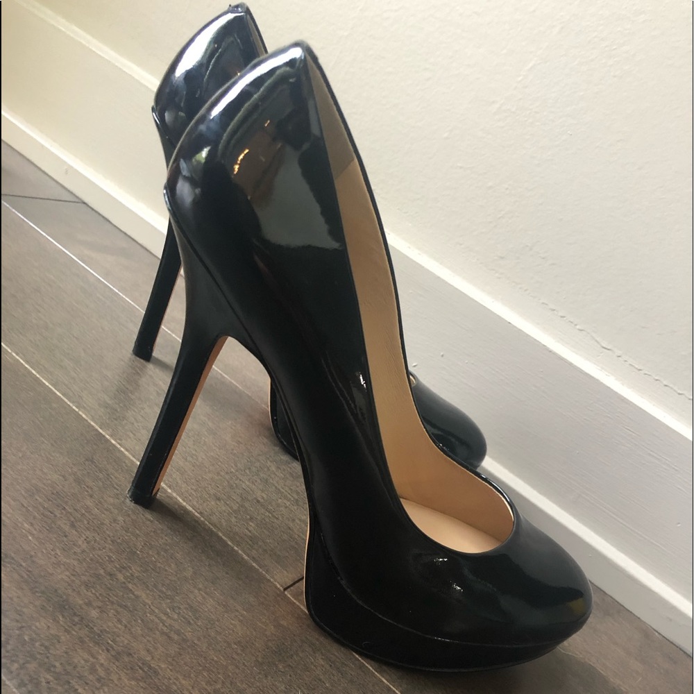 Joan and David black platform patent pumps